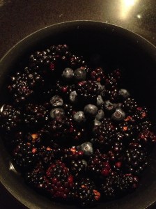Blueberries and blackberries in the sauce pan