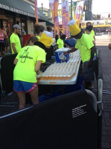 The Volunbeers are getting the cups of beer ready for the start.