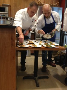 Chefs plating one of our courses